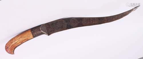 A 19TH CENTURY PERSIAN CALLIGRAPHIC DAGGER / KNIFE, the blade with animal motif and bands of