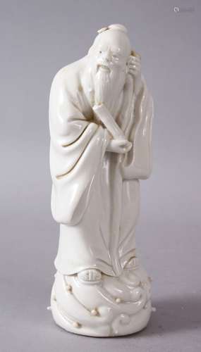 A 19TH/20TH CENTURY CHINESE BLANC DE CHINE PORCELAIN FIGURE of an immortal, 14cm high.