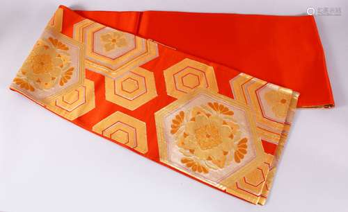 A FINE JAPANESE SILK EMBROIDERED FUKURO OBI TIE - upon an orange ground with silver and gold