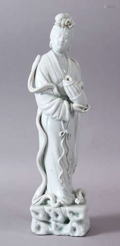 A GOOD 19TH/20TH CHINESE BLANC DE CHINE PORCELAIN FIGURE OF GUANYIN, holding an vessel, 33cm high.