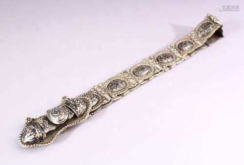 A RUSSIAN NIELLO DECORATED WHITE METAL BELT, consisting of an ornate buckle and fourteen oval