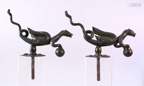 AN UNUSUAL PAIR OF CAST IRON DOOR KNOCKERS, in the form of mythical creatures, both approx. 30cm