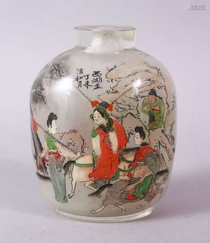 A 19TH CENTURY CHINESE REVERSE PAINTED SNUFF BOTTLE, with many figures and calligrpahy, 9cm high.