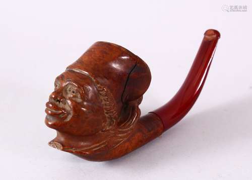 A CARVED WOOD SMOKING PIPE, the bowl in the form of an African male, the mouthpiece made of cherry