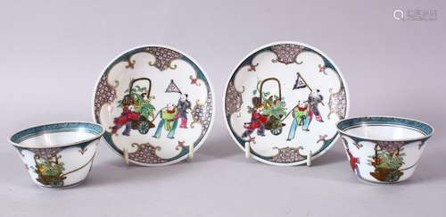 A PAIR OF CHINESE FAMILLE ROSE TEA BOWLS AND SAUCERS, decorated with figures.