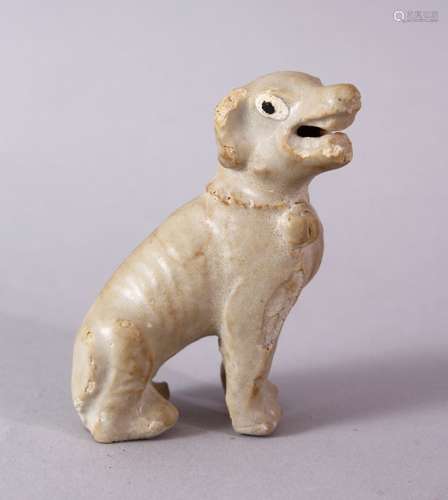 A SMALL CHINESE POTTERY SEATED DOG, 7cm high.