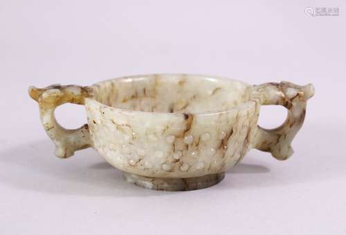 A CHINESE CARVED JADE ARCHAIC STYLE TWIN HANDLE CUP, with chilong handles, and boss decoration, 11cm