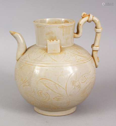 AN UNUSUAL CHINESE DING STYLE POTTERY TEA POT, with incised floral motifs, 15cm high x 14cm wide.