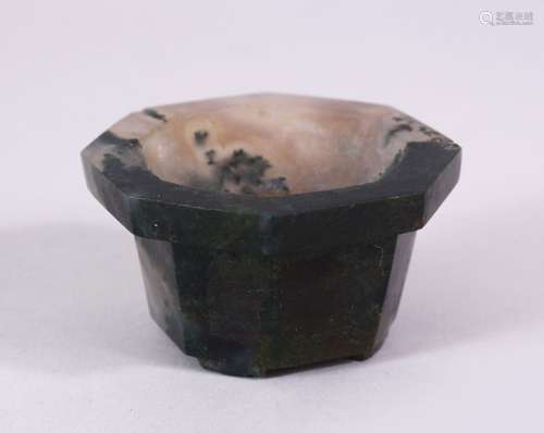 A 19TH CENTURY CHINESE OCTAGONAL JADE BRUSH WASHER, on bracket feet, 7cm diameter.