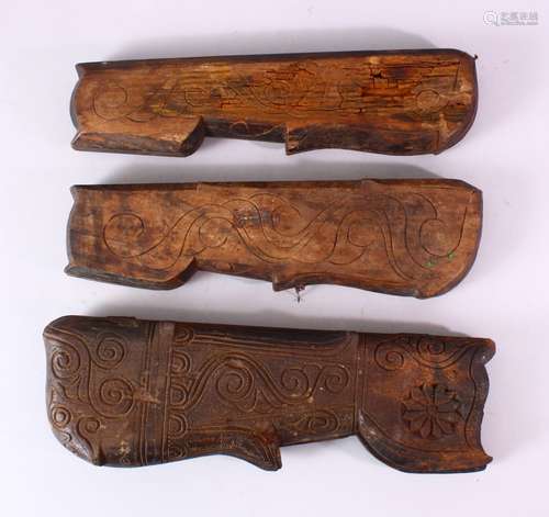 THREE INDIAN CARVED WOODEN SPICE BOXES, largest 40cm long.