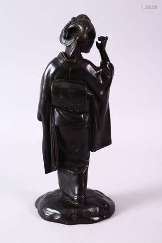 A 19TH CENTURY JAPANESE BRONZE FIGURE OF A GEISHA, with arm raised, 27cm high.