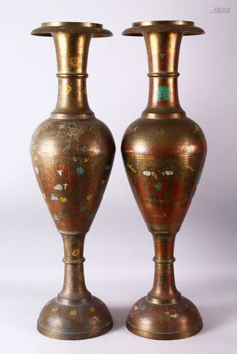 A LARGE PAIR OF 19TH/20TH CENTURY INDIAN BRASS FLOOR STANDING VASES, each with carved decoration