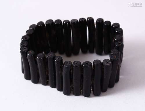 A BLACK CORAL BRACELET, open approx. 7cm diameter.