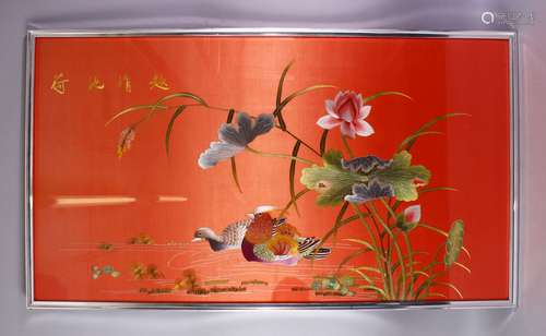 A LARGE CHINESE EMBROIDERED SILK / TEXTILE FRAMED PICTURE, of peking ducks among lotus sprays,