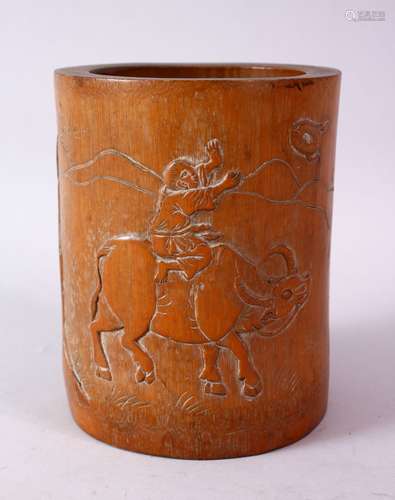 AN 18TH CENTURY CHINESE BAMBOO BRUSH POT, carved with a man riding an oxen with calligraphy, 15cm