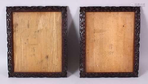 A PAIR OF 19TH CENTURY CHINESE CARVED WOOD PICTURE FRAMES, carved with prunus and scroll decoration,