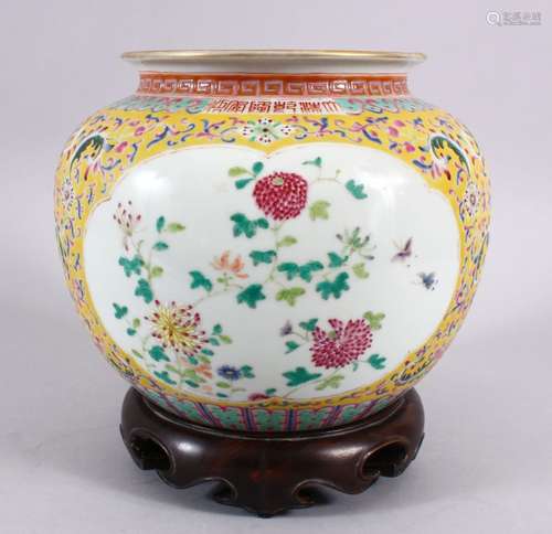 A CHINESE FAMILLE JAUNE PORCELAIN JAR & STAND, decorated with formal scrolling lotus, and panels