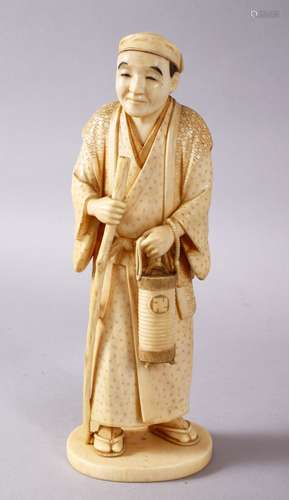 A JAPANESE MEIJI PERIOD CARVED IVORY OKIMONO - MAN, stood in traditional dress, holding his staff