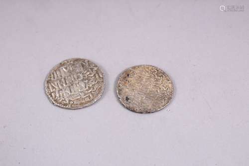 TWO EARLY SILVER ISLAMIC COINS.