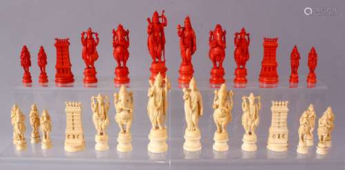 AN EARLY 20TH CENTURY IVORY AND STAINED IVORY INDIAN CHESS SET, carved as Indian gods and temples,