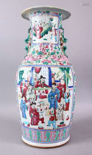 A 19TH CENTURY CHINESE CANTON FAMILLE ROSE PORCELAIN VASE, with moulded chilong and lion dog