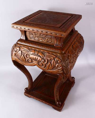 A LARGE JAPANESE MEIJI / TAISHO PERIOD CARVED WOODEN STAND, the top carved with chrysanthemum, the