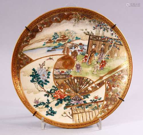 A FINE JAPANESE MEIJI PERIOD SATSUMA PLATE, decorated with panel views of figures in landscapes,