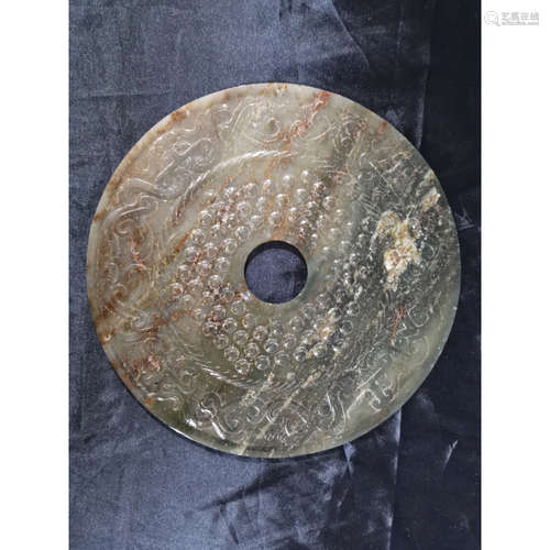 A Chinese Carved Celadon Jade Bi Disc