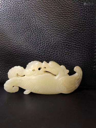 a chinese white jade dragon with fish