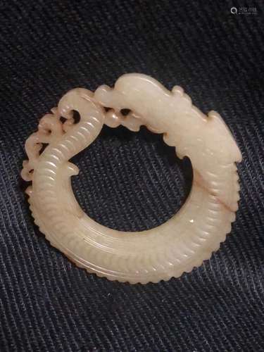 a chinese white jade dragon pendant