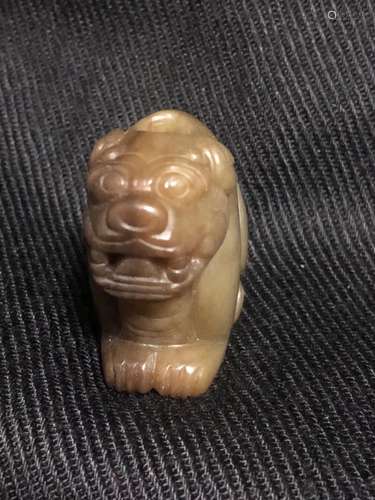 a chinese white jade carving of an animal