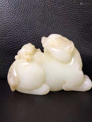 a chinese white jade carving of an animal