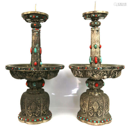 a pair of chinese silver candle holders