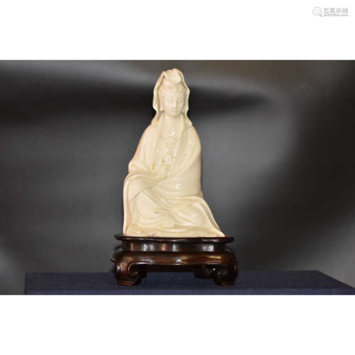 a chinese blanc-de-chine Guan Yin with zitan wood base