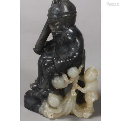 a chinese black and white jade figure