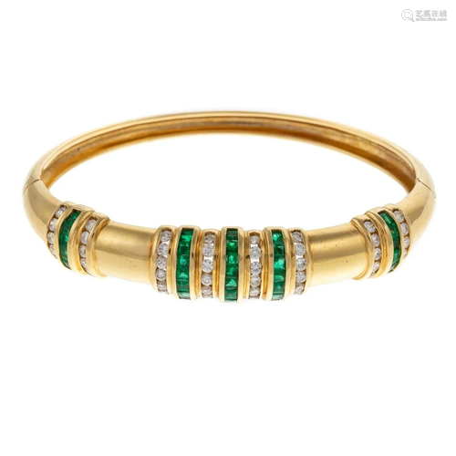 A Channel Set Emerald & Diamond Bangle in 18K