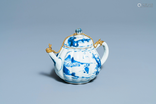 A Chinese gilt-mounted blue and white teapot and cover,