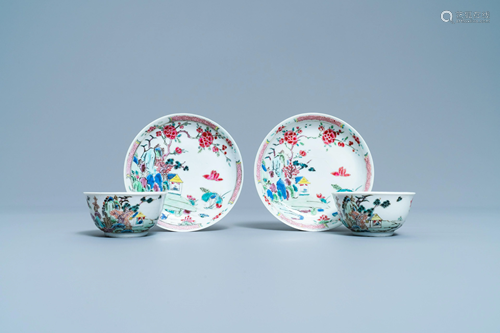 A pair of Chinese famille rose cups and saucers with