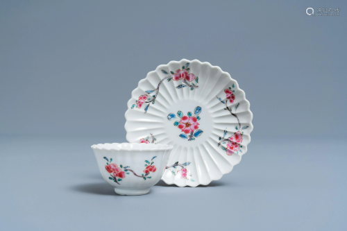 A lobed Chinese famille rose cup and saucer with floral