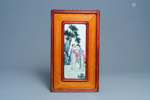 A Chinese famille rose plaque with two ladies in a