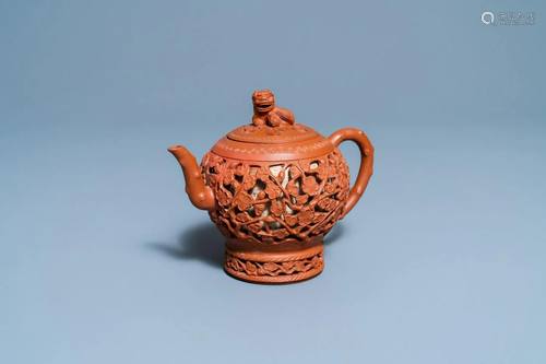 A Chinese reticulated Yixing stoneware teapot and