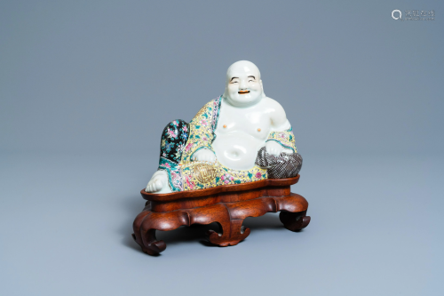 A Chinese famille rose figure of the reclining Buddha,
