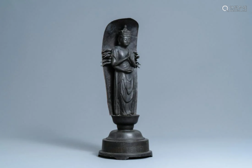 A Japanese inscribed bronze and copper alloy figure of