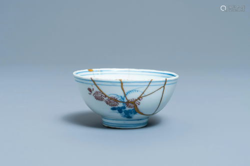 A Chinese blue, white and copper red bowl with kintsugi