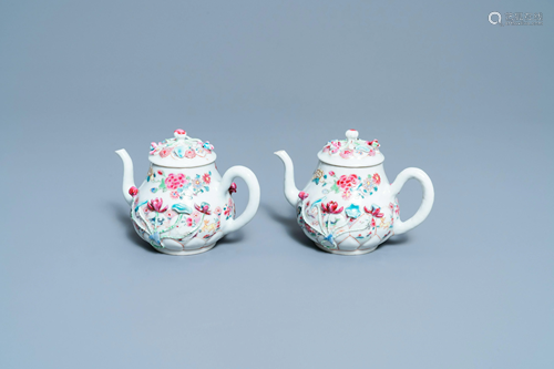 A pair of Chinese famille rose relief-decorated teapots