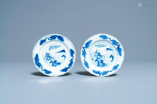 A pair of Chinese blue and white plates with boys