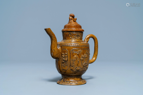 A Chinese brown-glazed relief-decorated teapot and