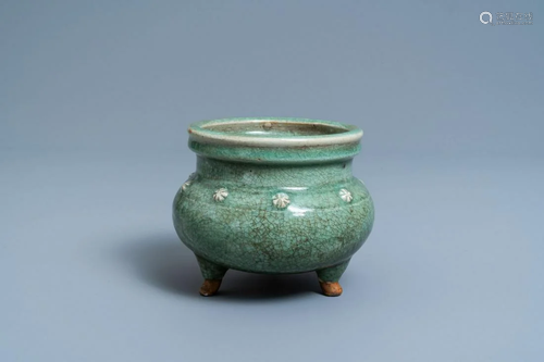 A Chinese monochrome celadon and crackle-glazed tripod