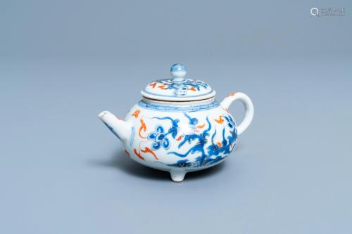 A Chinese blue, white, iron red and gilt tripod teapot