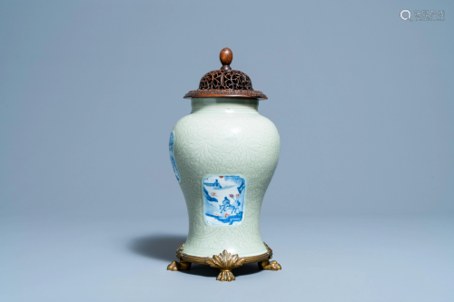 A Chinese incised celadon-glazed vase with blue, white